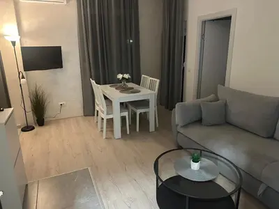 a living room with a couch and a table at Apt1- Sokobanjica apartmani in Soko Banja