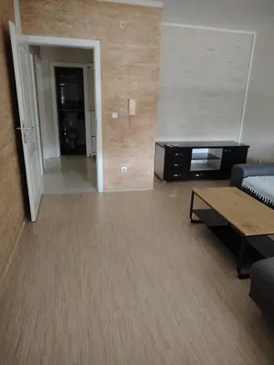 a living room with a couch and a table at Sofi in Jagodina