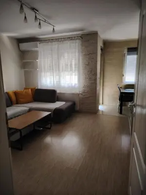 a living room with a couch and a table at Sofi in Jagodina
