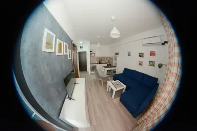 a view of a living room with a blue couch at AquaBlue Jagodina in Jagodina