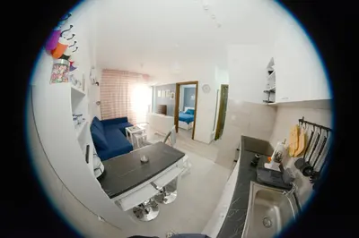 a kitchen with a tub and a sink in a room at AquaBlue Jagodina in Jagodina
