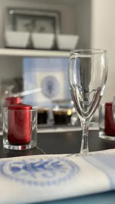 a wine glass sitting on top of a kitchen counter at AquaBlue Jagodina in Jagodina