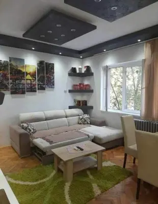 a living room with a couch and a table at Lola Jagodina in Jagodina