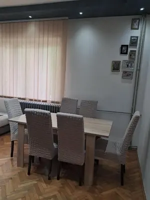 a conference room with a wooden table and chairs at Lola Jagodina in Jagodina