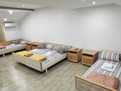 a living room with two beds and a couch at Kej apartman 2 duplex in Paraćin