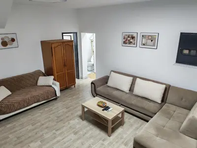 a living room with two couches and a coffee table at Kej apartman 2 duplex in Paraćin