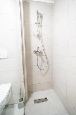 a bathroom with a shower and a sink at Todorović Lux Vrnjačka Banja in Vrnjačka Banja