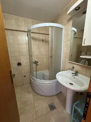 a bathroom with a shower and a sink at APARTMAN MiG in Vranje