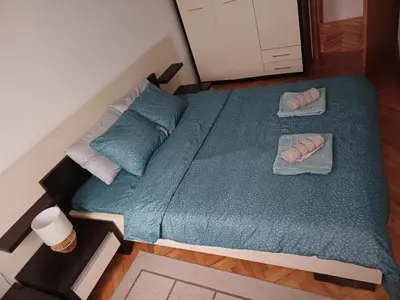an overhead view of a bed with two towels on it at APARTMAN MiG in Vranje