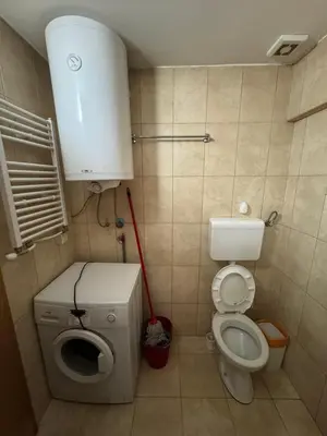 a small bathroom with a toilet and a sink at STAN NA DAN MiG -Vranje in Vranje