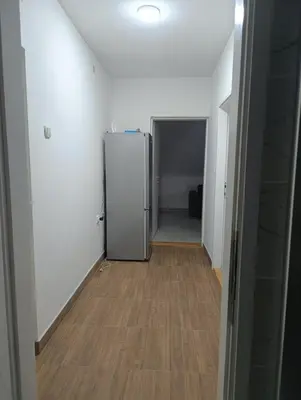 a hallway with a refrigerator in a room at Doma Toma, Bela Palanka Town in Bela Palanka