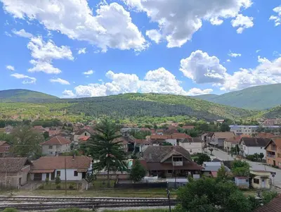 a town with houses and mountains in the background at Doma Toma, Bela Palanka Town in Bela Palanka