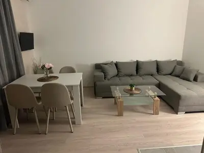 a living room with a couch and a table at Apt 6- Sokobanjica apartmani in Soko Banja