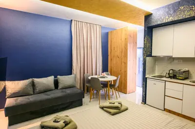 a living room with a couch and a table at Tanja Lux in Niš