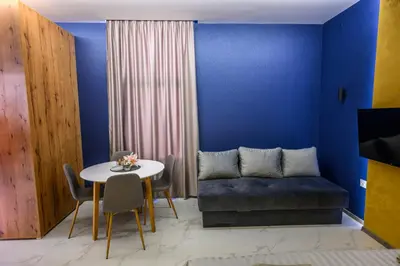 a living room with a couch and a table at Tanja Lux in Niš