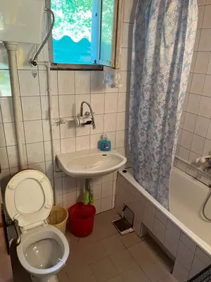 a bathroom with a toilet and a sink at Apartmani Radulovic in Kursumlijska Banja