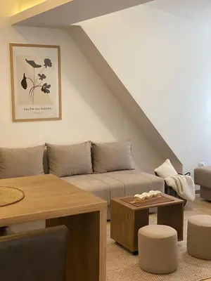 a living room with a couch and a table at Snow Hill Kopaonik in Kopaonik