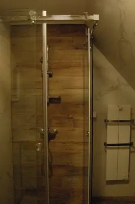 a glass shower in a bathroom with a toilet at Snow Hill Kopaonik in Kopaonik