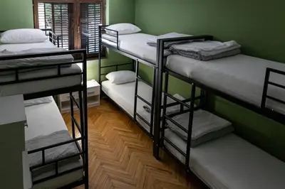 a group of bunk beds in a room at City Centre Hostel in Niš