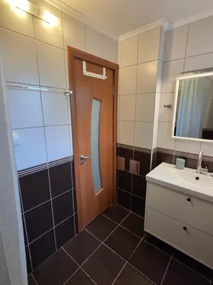 a bathroom with a shower and a sink and a mirror at Studio Sanader in Soko Banja