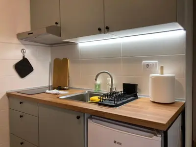 a kitchen with a sink and a counter top at Studio Sanader in Soko Banja
