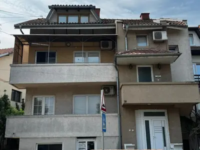 a building with a flag in front of it at Studio IV in Soko Banja