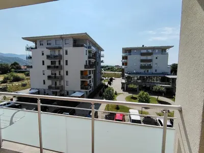a balcony with a view of two buildings at Apartman Fenix in Pirot