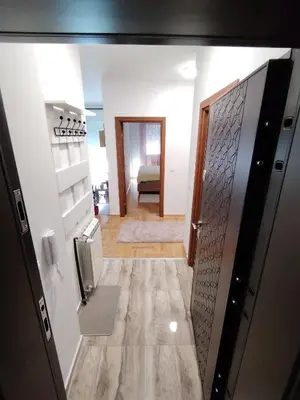 a hallway with a door leading to a room at Apartman Fenix in Pirot