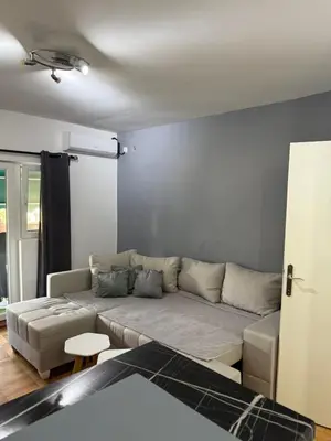 a living room with a couch in a room at Stan na dan Despotovac in Despotovac