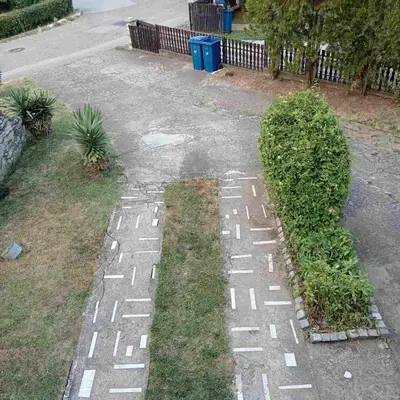 a street with white writing on the grass at Apartmani Sokobanja Alexandar in Soko Banja