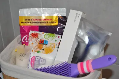 a basket with a toothbrush and other items in it at Star Apartman in Vranje