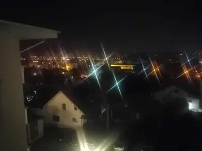a view of a city at night with lights at Studio-apartman DM lux in Vrnjačka Banja