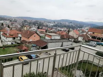 a view of a city with cars and buildings at Studio-apartman DM lux in Vrnjačka Banja