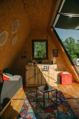 a room with a couch and a table in a house at Sve Mir in Boljevac
