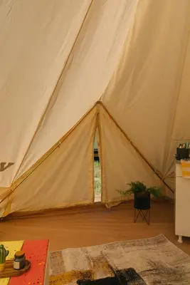 a tent with a door open in a room at Sve Mir in Boljevac