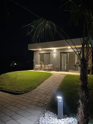 a house at night with a light in the yard at LaLuna Houses in Lipova