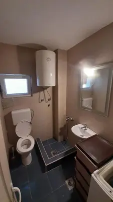 a small bathroom with a toilet and a sink at Dolce Vita in Bukorovac