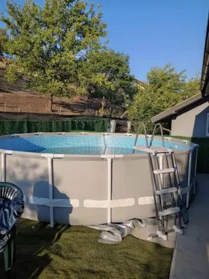 a bath tub with a ladder next to a swimming pool at Yellow hill Batinac in Ćuprija