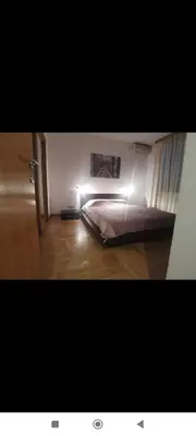 a bedroom with a bed with lights on it at Zora in Niš