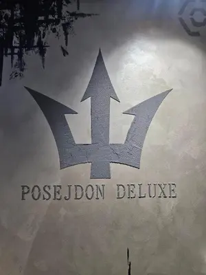 a sign that reads poseidon delvinuce on a wall at POSEJDON DELUXe 3 in Vrnjačka Banja