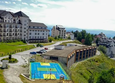 an aerial view of a building with a swimming pool at Una LUX N85 in Kopaonik
