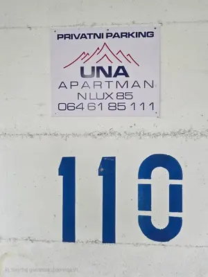 a sign on a building with the number one at Una LUX N85 in Kopaonik