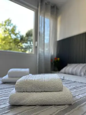 two towels are sitting on top of a bed at Stan na dan Raška in Raška