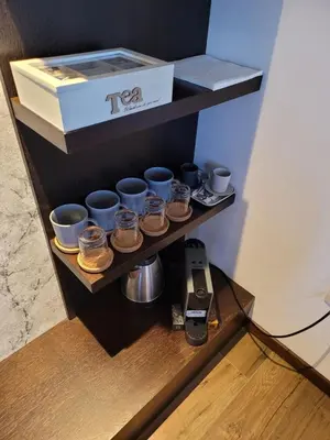 a shelf with cups and a box on it at Zoi i Nika Kopaonik in Kopaonik