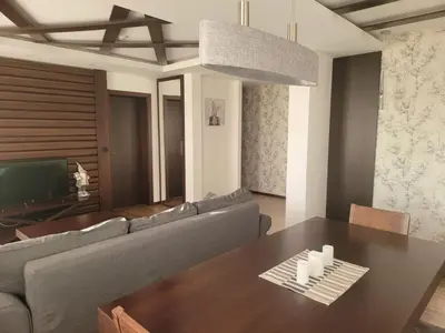 a living room with a couch and a table at Zoi i Nika Kopaonik in Kopaonik