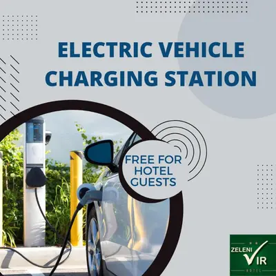 an electric vehicle charging station with a sign that reads free for hotel guests at Hotel Zeleni Vir in Niš
