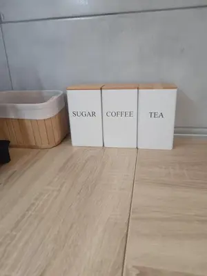 three boxes sitting on the floor next to a tub at Udoban kutak 2 in Niš