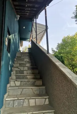 a set of stairs leading up to a building at Apartman Pače in Raška