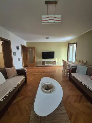 a living room with two couches and a table at Toplica in Vrnjačka Banja