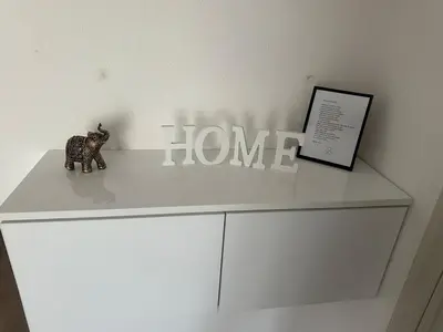 a white dresser with a toy elephant on top of it at Daily corner in Bujanovac